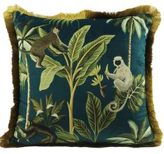 a pillow with monkeys and leaves on it