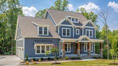 a large blue house with lots of windows