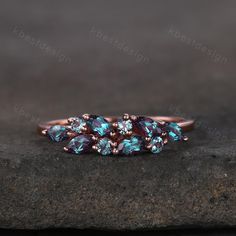 three stone ring with blue topazte and pink bottomazte in rose gold