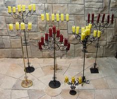 a group of candles that are on some kind of stand