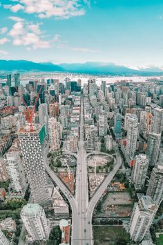 an aerial view of a city with lots of tall buildings