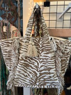 Switch up your look with the 00A7 Quincy Tote Bag - Natural! Crafted with natural zebra strips and detailed with tassels, this bag looks fetching and wild. And it's more than just a showpiece - it comes equipped with handy pockets on the inside, making it the ideal getaway bag! So, leave behind the same-old and go wild with the Quincy Tote Bag. Everyday Use Zebra Print Tote Bag, Everyday Zebra Print Tote Bag, Travel Zebra Print Rectangular Bag, Rectangular Zebra Print Travel Bag, Travel Rectangular Zebra Print Bag, Shreveport Louisiana, Leave Behind, Go Wild, Social Media Platforms