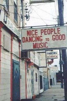 a sign that says nice people dancing to good soul music on the side of a building