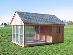 a chicken coop in the middle of a field