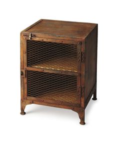 an old wooden cabinet with two shelves on one side and metal mesh doors on the other