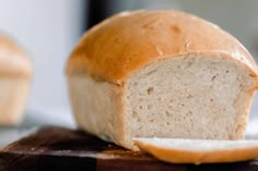 a loaf of bread sitting on top of a cutting board