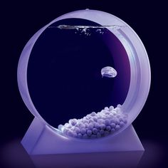 an aquarium filled with lots of white balls