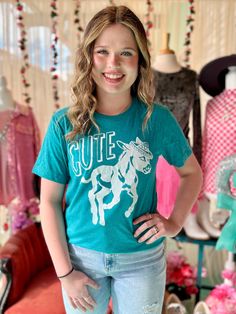 The PLUS Cute Tee adds a pop of color to your wardrobe. Made with short sleeves and a crew neck, it's perfect for casual days. The teal color is sure to stand out, while the adorable donkey give this tee a touch of cuteness. 50% polyester, 25% cotton, and 25% rayon Teal Color, Pop Of Color, Teal Colors, Color Pop, Short Sleeves, Crew Neck, Wardrobe, Best Deals, T Shirt