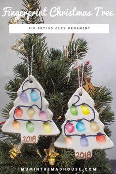 two christmas ornaments hanging from a tree with the words fingerprint christmas tree written on them