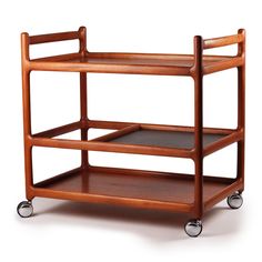 a wooden serving cart with two trays on wheels and one shelf is open to the side