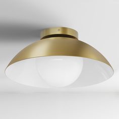 a white and gold light hanging from the ceiling