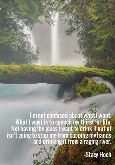 a waterfall in the middle of a forest with a quote on it that reads, i'm not confused about what i want