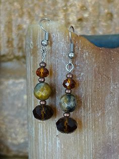 Beautiful in their simplicity, these beautiful earrings feature natural Tiger's Eye and matching crystals. ALL LISTINGS PRICED AT $15 IN THE 3 FOR $25 GROUP ARE NOW ON SALE!  The following discount applies ONLY to earrings from this group and can ONLY be applied to groups of 3!  Enter MEGASALE45 at checkout to receive your discount!  I craft original, to order, and customizations on weekends, and ship Tuesday.  Orders placed for in stock, as-is items ship within 3 business days or faster.  If you need a piece in a hurry, please shoot me a note and let me know so that I can do my best to accommodate you! Handcrafted with love in the beautiful Pacific Northwest. I craft original, to order, and customizations on weekends, and ship Tuesday.  Orders placed for in stock, as-is items ship within Mismatched Jewelry, Tiger Earrings, Eye Of The Tiger, Tiger Eye Earrings, Rose Quartz Earrings, Eye Earrings, The Tiger, Quartz Earrings, Tiger's Eye