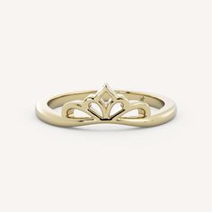 a gold ring with an open heart on the middle, and two hearts in the middle