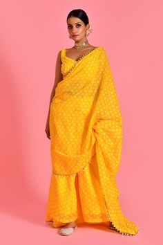 Yellow palazzo with bandhani pattern and pearl tassel embellished border on attached pallu. Paired with embellished padded blouse. - Aza Fashions Georgette Palazzo Set With Pallu In Traditional Drape, Traditional Draped Palazzo Set With Pallu In Georgette, Traditional Drape Palazzo Set With Pallu, Silk Palazzo Set Saree For Diwali, Festival Reception Palazzo Set With Cutdana, Art Silk Palazzo Set With Unstitched Blouse, Unstitched Gota Work Pre-draped Saree, Festive Chanderi Palazzo Set For Reception, Festival Chanderi Palazzo Set For Reception