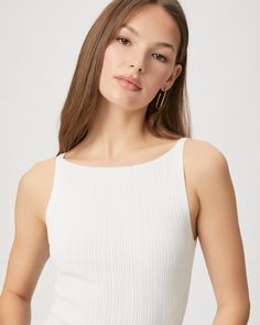 Crafted from a nylon blend with an elevated feel, this sophisticated white sleeveless sweater tank is designed with a pleated effect and a boat neckline. Yuelia is the perfect piece that adds a subtle statement to your summer wardrobe. | Yuelia Tank Top - White | Size XL Elegant White Scoop Neck Tank Top, Elegant Ribbed Tank Top For Summer, Elegant Ribbed Summer Tank Top, White Scoop Neck Knit Top For Summer, Elegant Fitted White Knit Top, White Sleeveless Fitted Knit Top, White Fitted Sleeveless Knit Top, Chic White Ribbed Tank Top, White Ribbed Sleeveless Knit Top