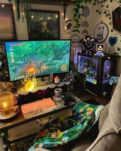 a living room filled with lots of furniture next to a computer monitor on top of a desk