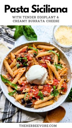 pasta siciliana with tender eggplant and creamy burrata cheese in a white bowl