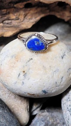 This is a lapis and sterling silver ring. The front of the ring is 1/4 of an inch tall. It retailed at $32. It comes in a jewelry box for gifting. Blue Opal Ring In Sterling Silver, Spiritual Style, Nickel-free Blue Stackable Rings As A Gift, Rings Statement, New Vintage, Sterling Silver Ring, Statement Rings, Sterling Silver Rings, Silver Ring, The Ring