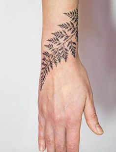 a person's hand with a tattoo on it and the words moguli, art london, united kingdom follow