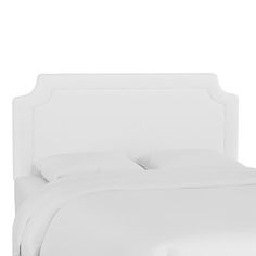 a bed with white linens and pillows on it's headboard, against a white background