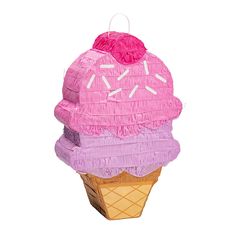 an ice cream cone with pink frosting and sprinkles on the top