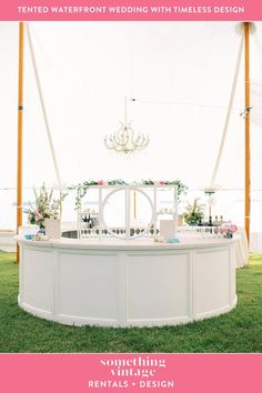 an outdoor wedding with white tables and chandelier