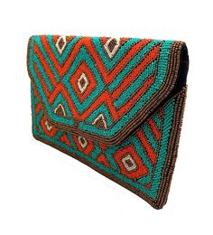 Meet your new best accessory! Check out this beautifully handcrafted multicolor, beaded clutch. Let your bag complete your outfit. Traditional Beaded Pouch Clutch, Multicolor Rectangular Clutch With Handwork, Rectangular Multicolor Clutch With Handwork, Multicolor Rectangular Evening Bag With Handwork, Embroidered Multicolor Clutch Evening Bag, Multicolor Handwork Rectangular Evening Bag, Bohemian Beaded Rectangular Evening Bag, Trendy Multicolor Clutch Evening Bag, Chic Multicolor Clutch For Everyday Use