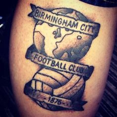 a close up of a person's leg with a tattoo on it that says birmingham city football club