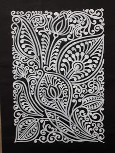 a black and white paper with an intricate design on it