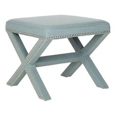 a light blue stool with studded trimmings