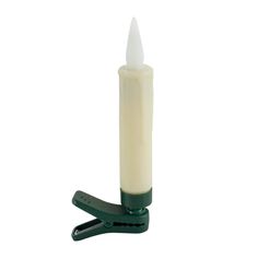 a white candle with a green handle on a white background