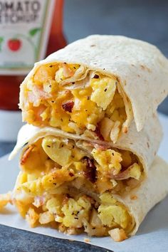 two breakfast burritos stacked on top of each other