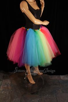 "Perfect tutu for Pride! This tulle tutu skirt Can also be used for carnivals, weddings, costumes, clowns, or anything rainbow themed! This tutu design is extra fluffy! This rainbow tutu design is Handmade from 50yards, two layers of gathered panels of soft smooth red, orange, yellow, mint, green, turquoise, purple, fuchsia and hot pink Bridal tulle. All tulle panels have been tightly machine gathered and serged to the soft rainbow fabric covered elastic waistband. This tutu is fully sewn not ti Spring Costume Party Tutu Dress With Tulle Skirt, Multicolor Tulle Tutu Dress For Costume Party, Fun Fitted Tutu Dress For Party, Fitted Multicolor Tutu Dress For Fun, Spring Costume Tulle Tutu Dress, Fun Fitted Multicolor Tutu Dress, Spring Tulle Tutu Dress For Costume, Fitted Multicolor Tutu Dress, Fitted Tutu Dress For Carnival Costume Party