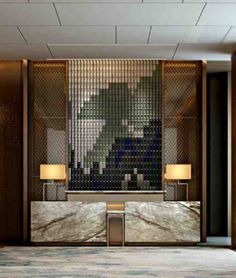 an elegant lobby with marble walls and flooring