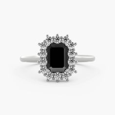 a black and white diamond ring on a white background