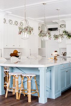 the instagram page shows an image of a kitchen with blue cabinets and stools