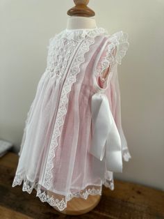 Sleeveless Lace Bodice Dress For Baptism, Sleeveless Lace Dress With Lace Bodice For Baptism, Formal Lace Dress With Lace Patchwork, White Lace Dress For Dress-up, Sleeveless Lace Dress For Baptism, White Lace Dress For Dress-up Occasion, White Lace Dress With Lace Trim For Dress-up, Classic White Dress With Lace Bodice, Classic Lace Dress For First Communion