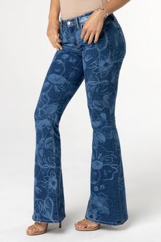 Mid-rise, medium-wash flare jeans- Laser printed floral design- Traditional back pocket design- Embossed white leather Miss Me brand patch- Subtle distress on front right pocket- 5-pocket designModel is wearing size: 25Model Measurements:Height: 5'9"Bust: 32"Waist: 26"Hips: 35"Fabric Content: 73% Cotton, 24% Polyester, 3% ElastaneCare: Gentle machine wash inside-out with like colors in cold water. Tumble dry low.Style No. M2327F-M909, M2327FV-M909, M2327FS-M909 Wide Leg Floral Print Denim Jeans, Wide Leg Floral Denim Jeans, Wide Leg Denim Jeans With Floral Print, Fitted Floral Print Jeans In Denim Blue, High Rise Denim Jeans With Floral Print, Fitted Denim Blue Jeans With Floral Print, Fitted Floral Print Denim Blue Jeans, Blue Jean, Pocket Design