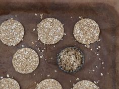 six oatmeal cookies on a baking sheet ready to be baked