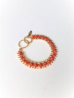 Unique braided colorful chain link bracelet for women, great for stacking for a perfect summer look. Material: metal is brass plated with either gold or white gold- 24k nickel free. Thread is waxed cotton. Dimentions: Length is 7 inch (18cm) , width is 0.4 inch (1 cm) - Arrives in labeled gift box, ready to give as a gift - Ships within 3 business days View my other bracelets: https://etsy.me/2xGTBBo Back to Home Page: https://www.etsy.com/il-en/shop/ZOZidesign?ref=hdr_shop_menu Coral Bangle Bracelet As Gift, Orange Beaded Bracelet With Lobster Clasp As Gift, Handmade Adjustable Red Chain Bracelet, Adjustable Coral Bracelets As A Gift, Adjustable Orange Beaded Bracelet With Lobster Clasp, Adjustable Hand-strung Coral Bracelets, Adjustable Coral Stretch Bracelet, Unique Gold Bracelet, Unique Gold Jewelry