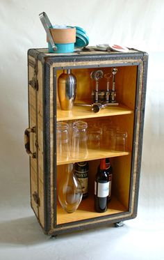 an old suitcase with some bottles in it and a toothbrush on the top shelf