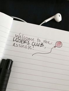 a notepad with the words welcome to the users club, and an earphone