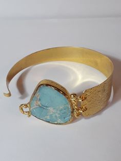 Brass Handmade bracelet with turquoise stone / Jewelry for you, jewelry for gif Brass Handmade bracelet with turquoise stone A very nice full bracelet with smart lock A unique fantastic jewelry for a surprise gift Total Diameter 19 cm, stone 3x2.5 cm From Ioannina, Greece will be shipped with a security number Metal Gemstone Bracelets As Gift, Metal Gemstone Bracelets For Gifts, Gemstone Metal Bracelets For Gifts, Handmade Metal Bracelets For Gifts, Gold Cuff Bracelet With Natural Stones For Gift, Adjustable Turquoise Jewelry Gift, Turquoise Bracelet Jewelry Gift, Turquoise Metal Cuff Bracelet As Gift, Turquoise Metal Cuff Bracelet Gift