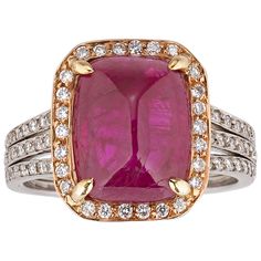 A rare Burma cabochon ruby positively captivates amid a halo of diamonds in this extraordinary ring. The exceptional jewel weighs 6.31 carats and its sugarloaf cut perfectly showcases the intense red hue for which Burma rubies are so coveted. Certified by C. Dunaigre Switzerland as a natural, no-heat ruby, the gem is encircled by 26 sparkling round diamonds set in 18k yellow gold, enhancing the stone’s unique color. Additional diamonds are embedded in the ring’s platinum band, adding further luxury to this exquisite piece. Gold Filigree Necklace, White Gold Diamond Wedding Rings, Dazzling Jewelry, Ruby And Diamond Necklace, Cabochon Ruby, Ruby Rings, Diamond Cluster Earrings, Vintage Cocktail Ring, Round Diamond Setting