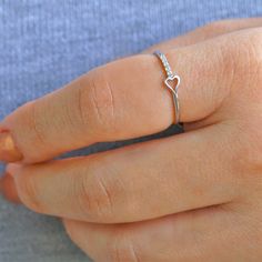 This simple yet beautiful diamond heart ring is stamped with 14k/18k gold. The ring is made with real gold and diamonds. You can get the ring engraved with your friends or lovers to use it as a friendship ring or promise ring. The ring also makes a great gift for little girls and daughters. Other Heart Rings: https://etsy.me/2O2ikL8 https://etsy.me/2GlsVe5 Heart Diamond Ring Details: Natural Diamond Total Carat: 0.04 carats Total number of diamonds: 5 Diamond Color: G Diamond Clarity: SI (Eye cl Heart Diamond Ring, Small Diamond Rings, Cheap Diamond Rings, Heart Promise Rings, Fire Opals Jewelry, Friendship Ring, Gold Heart Ring, Gold Color Ring, Diamond Heart Ring