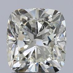 a cushion cut diamond on a gray background