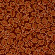 an orange and red fabric with leaves on it