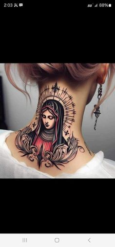 a woman's neck with a tattoo on the back of her head and an image of a virgin mary