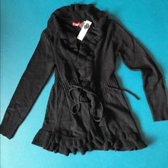 Elle Black Sweater Jacket Ruffle Collar Small (Bin #C) Winter Ruffled Long Sleeve Cardigan, Trendy Long Sleeve Outerwear With Ruffles, Casual Ruffled Outerwear For Fall, Trendy Fall Cardigan With Ruffles, Trendy Ruffled Winter Cardigan, Fall Hooded Outerwear With Ruffles, Hooded Fall Outerwear With Ruffles, Casual Fitted Outerwear With Ruffles, Casual Winter Ruffle Cardigan